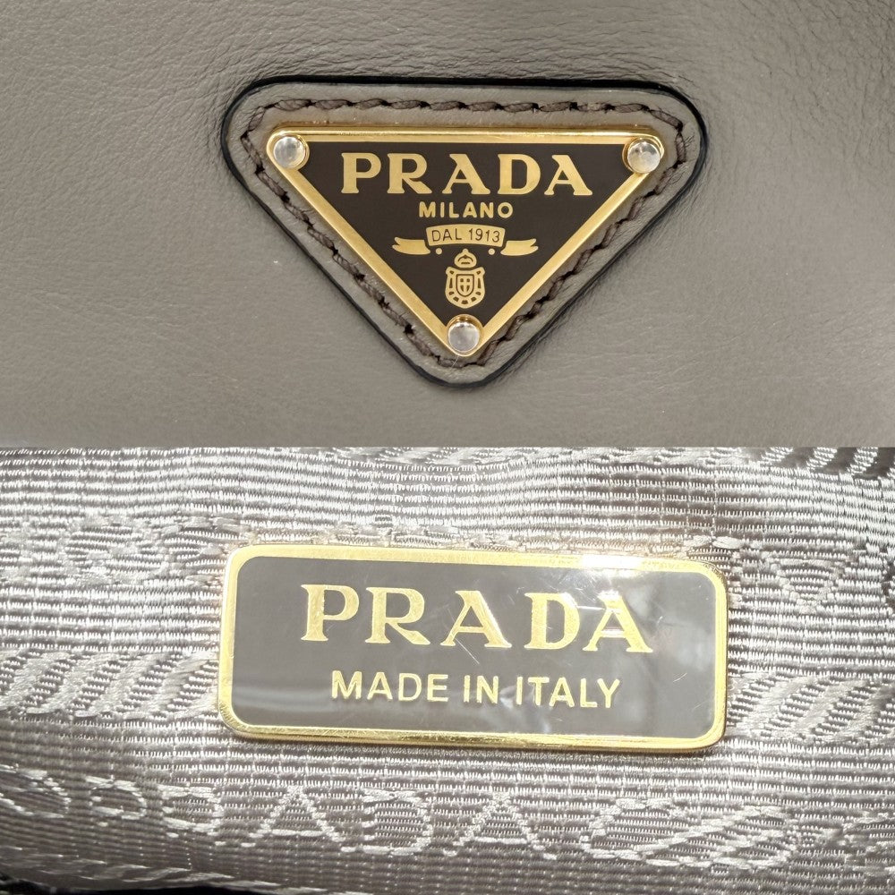 【開店SALE】 PRADA プラダ 2WAY 巾着 トライアングルロゴ ハンドバッグ ショルダーバッグ 1BE067 レザー ベージュ ゴールド金具 レディース【中古品】